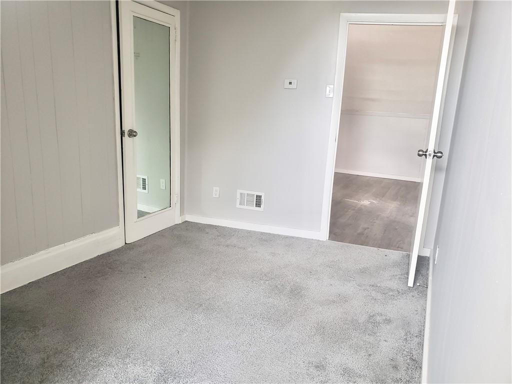 1234 Itin Street, Unit 5 Pittsburgh, PA 15212 - Photo 12 of 16 an empty room with an entryway