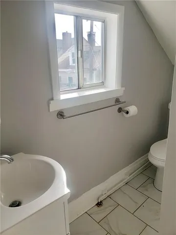 a bathroom with a sink and a toilet