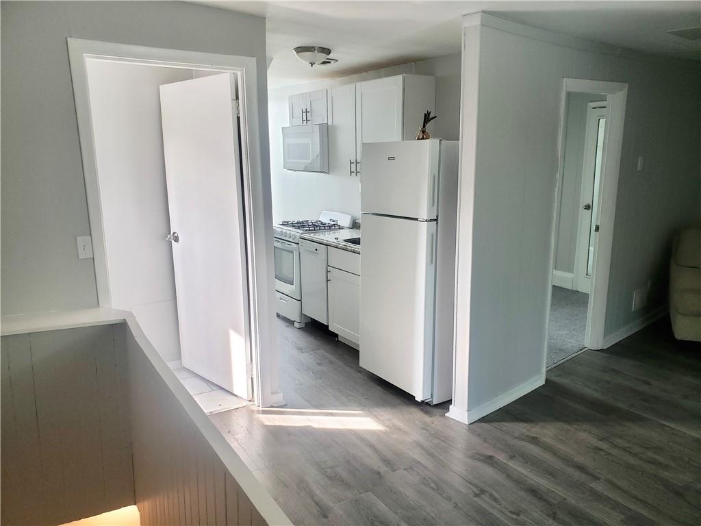 1234 Itin Street, Unit 5 Pittsburgh, PA 15212 - Photo 4 of 16 a kitchen with stainless steel appliances a refrigerator and a stove top oven