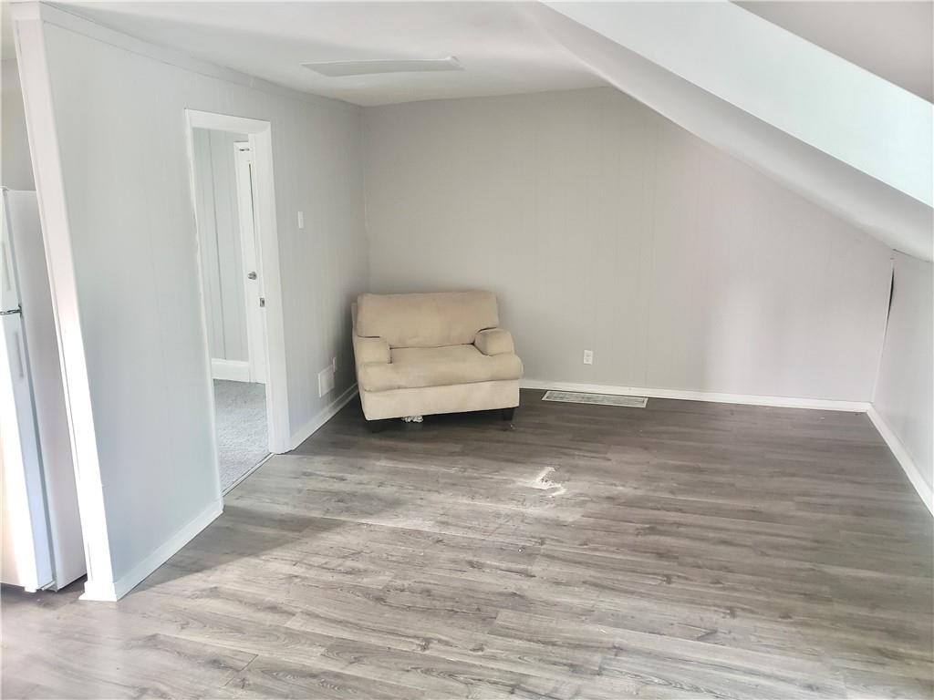 1234 Itin Street, Unit 5 Pittsburgh, PA 15212 - Photo 5 of 16 a view of room with wooden floor