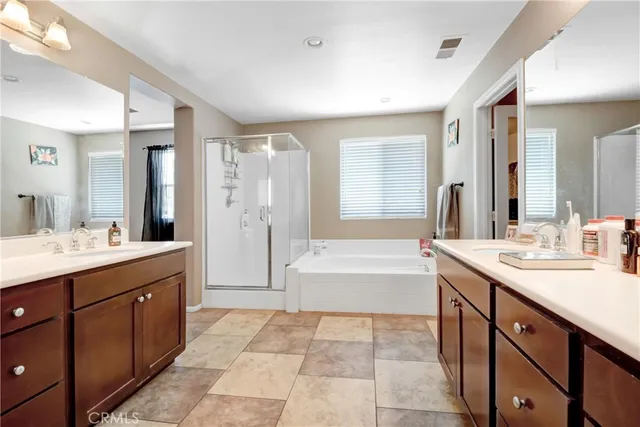 a spacious bathroom with a sink a toilet and shower
