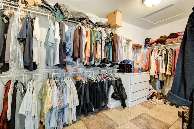 a spacious bathroom with a tub sink shower and mirror