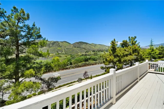 a view of walk in closet with clothes