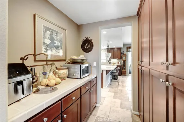 a view of a dining room with furniture and chandelier