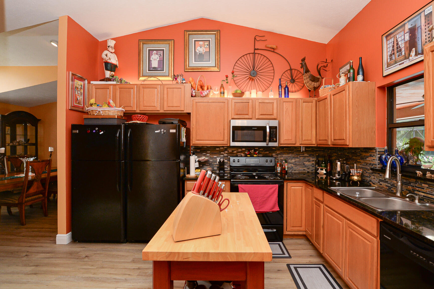 3068 Southeast Darien Road Port St. Lucie, FL 34952 - Photo 17 of 54 a kitchen with stainless steel appliances granite countertop a stove and a refrigerator