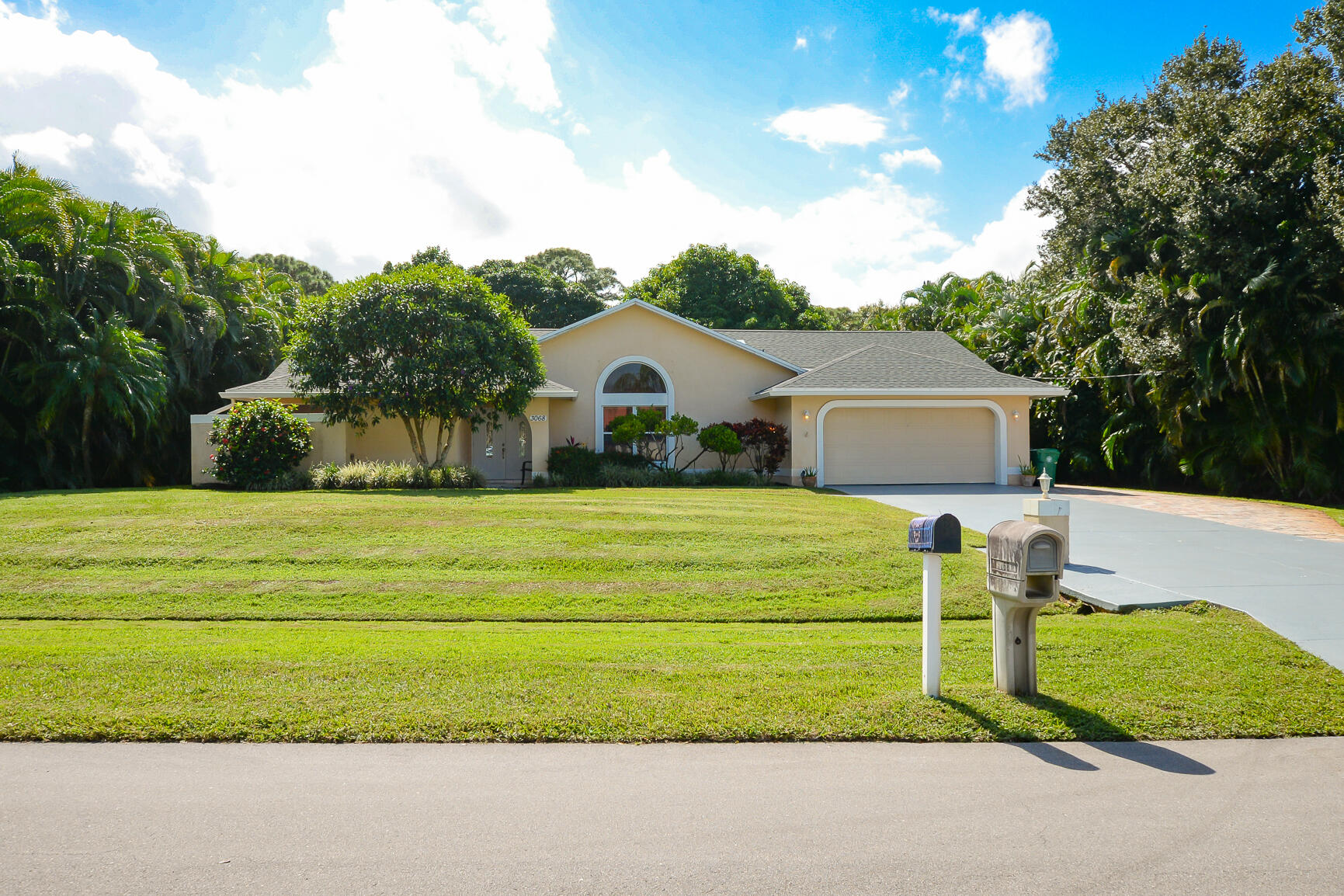 3068 Southeast Darien Road Port St. Lucie, FL 34952 - Photo 2 of 54 a front view of a house with a yard