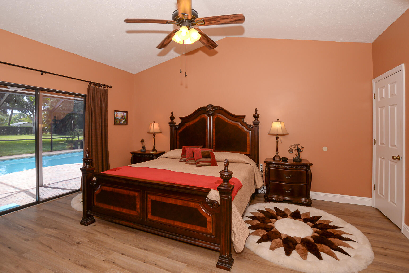 3068 Southeast Darien Road Port St. Lucie, FL 34952 - Photo 24 of 54 a bedroom with a bed and a chandelier