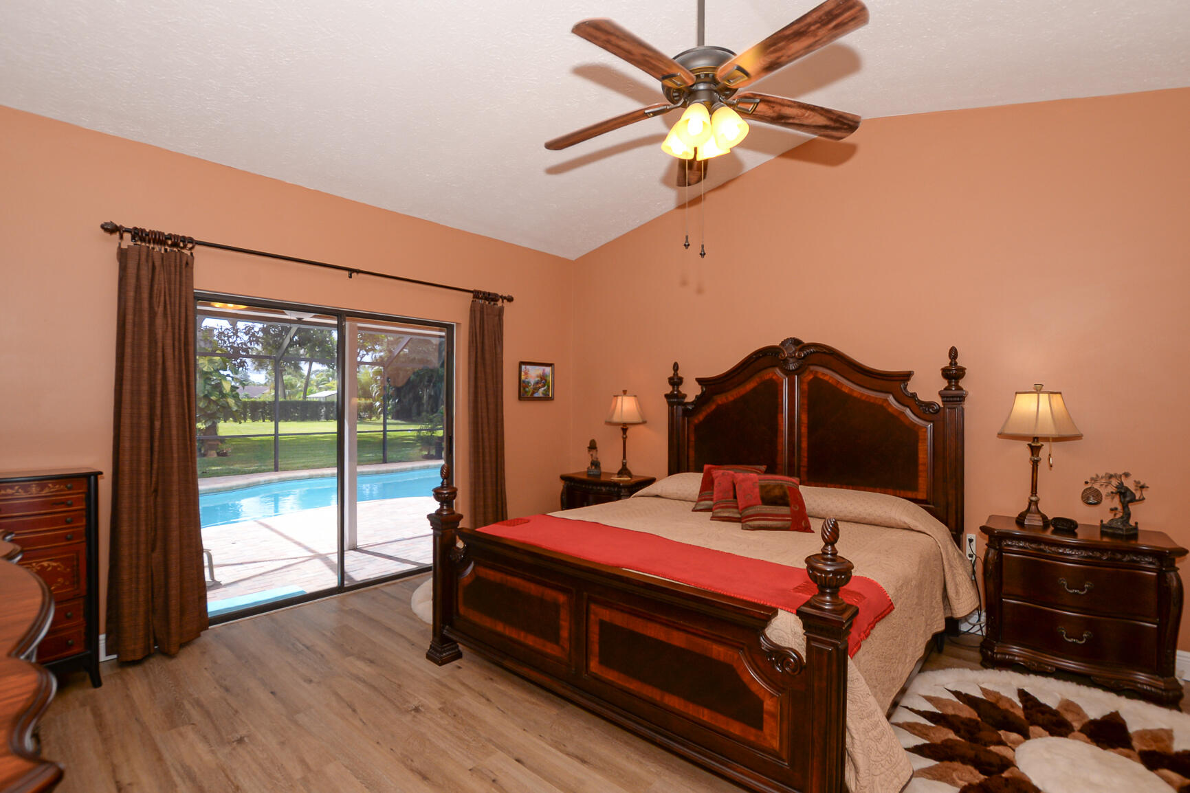 3068 Southeast Darien Road Port St. Lucie, FL 34952 - Photo 25 of 54 a bedroom with a bed and a chandelier