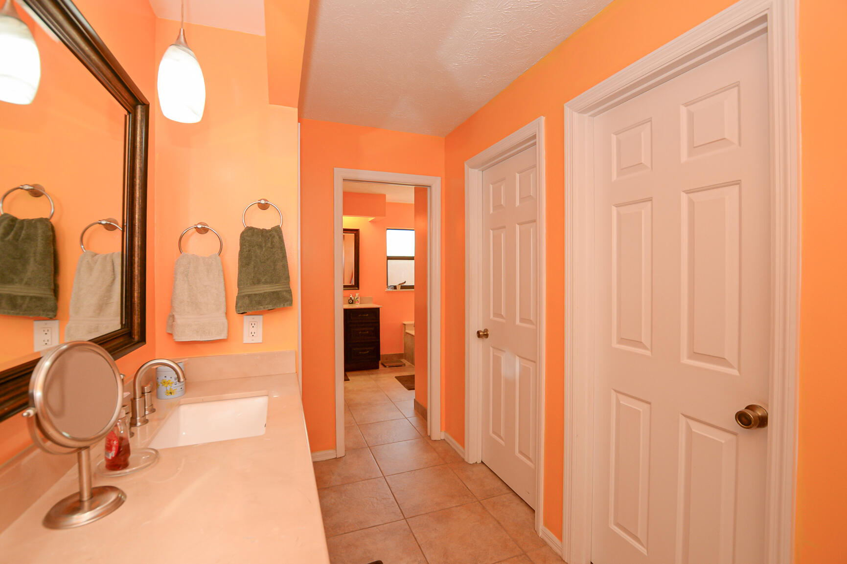 3068 Southeast Darien Road Port St. Lucie, FL 34952 - Photo 30 of 54 a bathroom with a granite countertop sink and a mirror