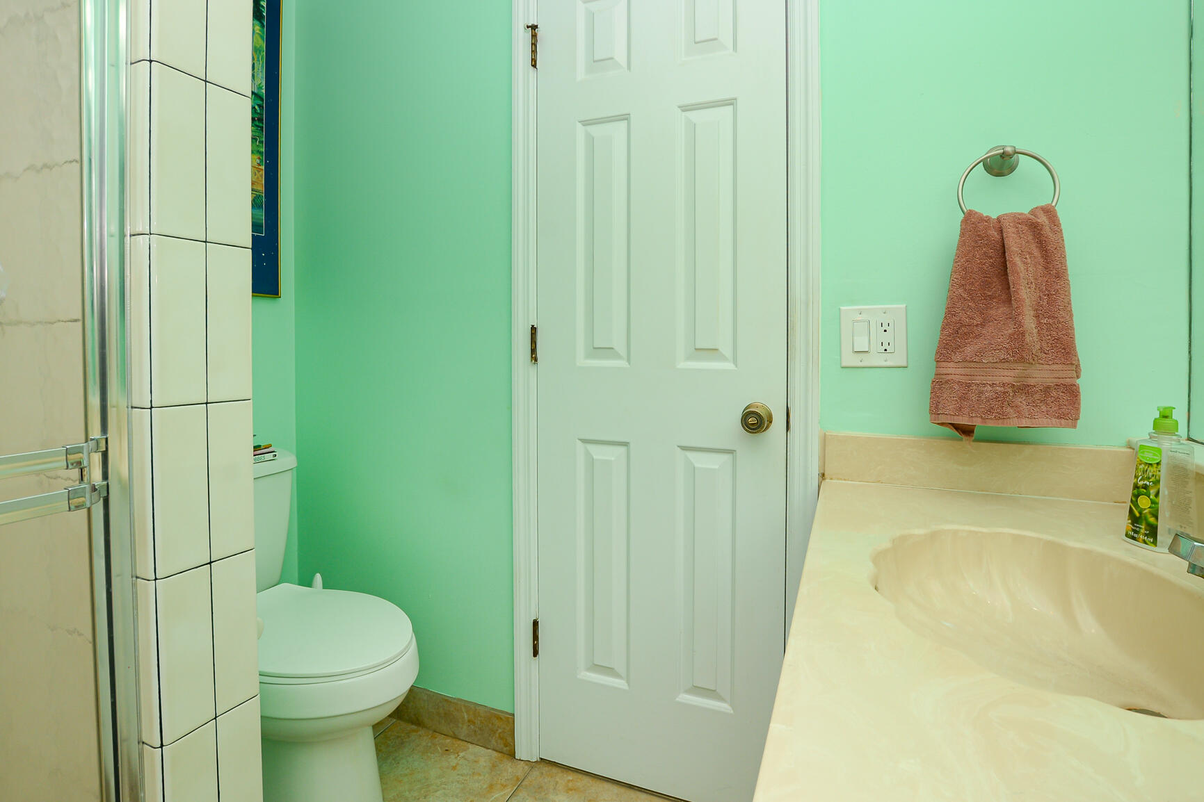 3068 Southeast Darien Road Port St. Lucie, FL 34952 - Photo 33 of 54 a bathroom with a sink a toilet and shower