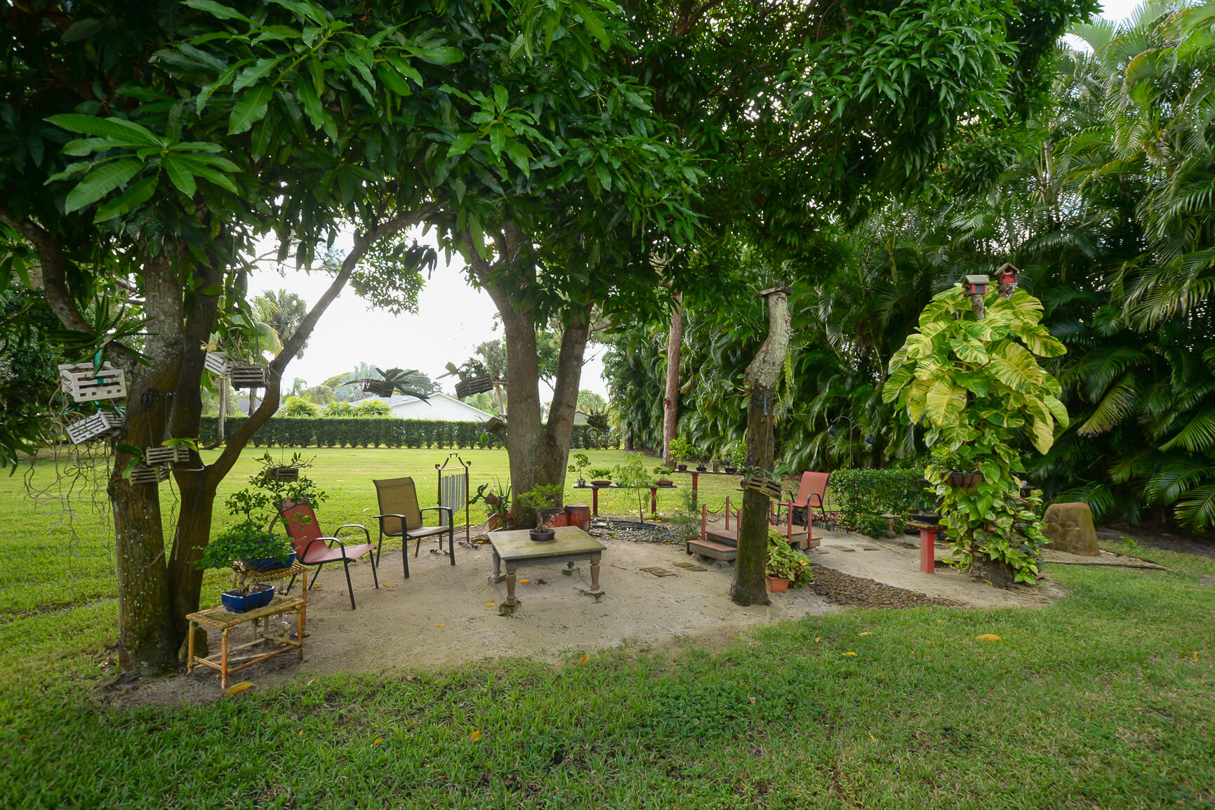 3068 Southeast Darien Road Port St. Lucie, FL 34952 - Photo 46 of 54 a swimming pool with outdoor seating and garden
