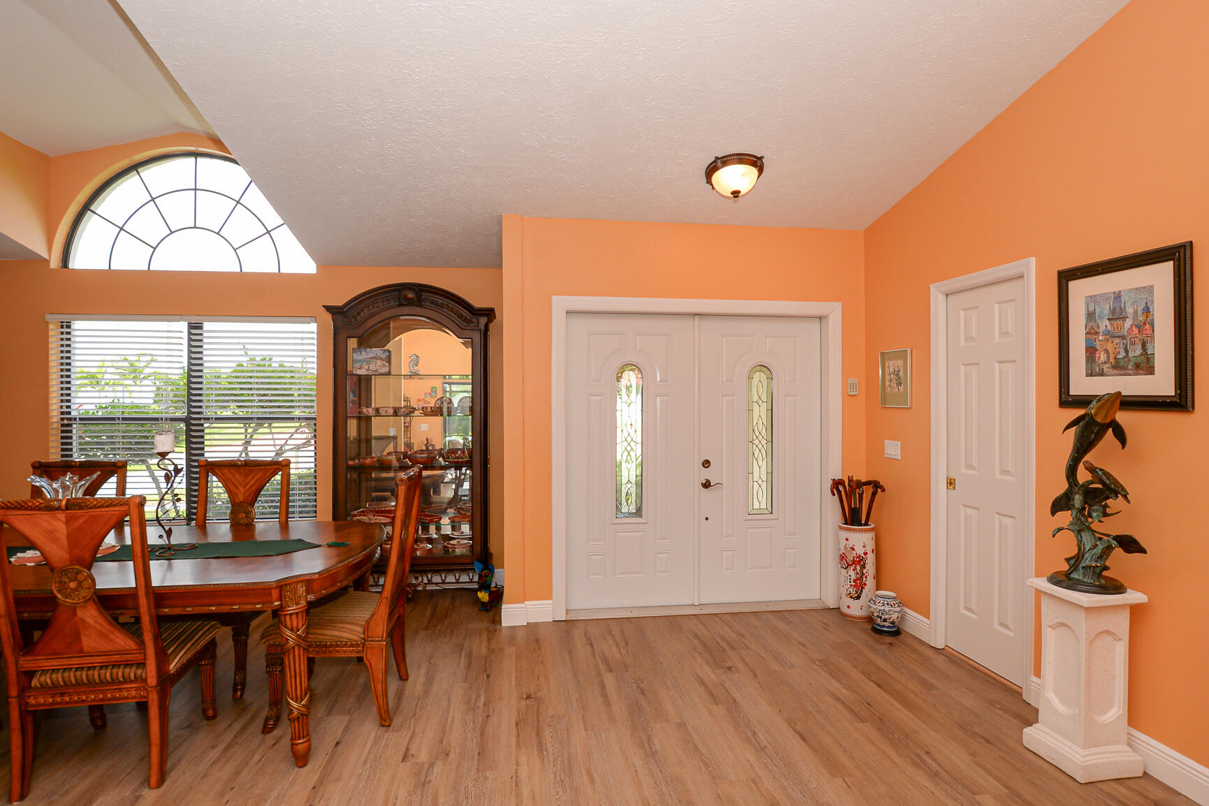 3068 Southeast Darien Road Port St. Lucie, FL 34952 - Photo 6 of 54 a view of a dining room with furniture window and wooden floor