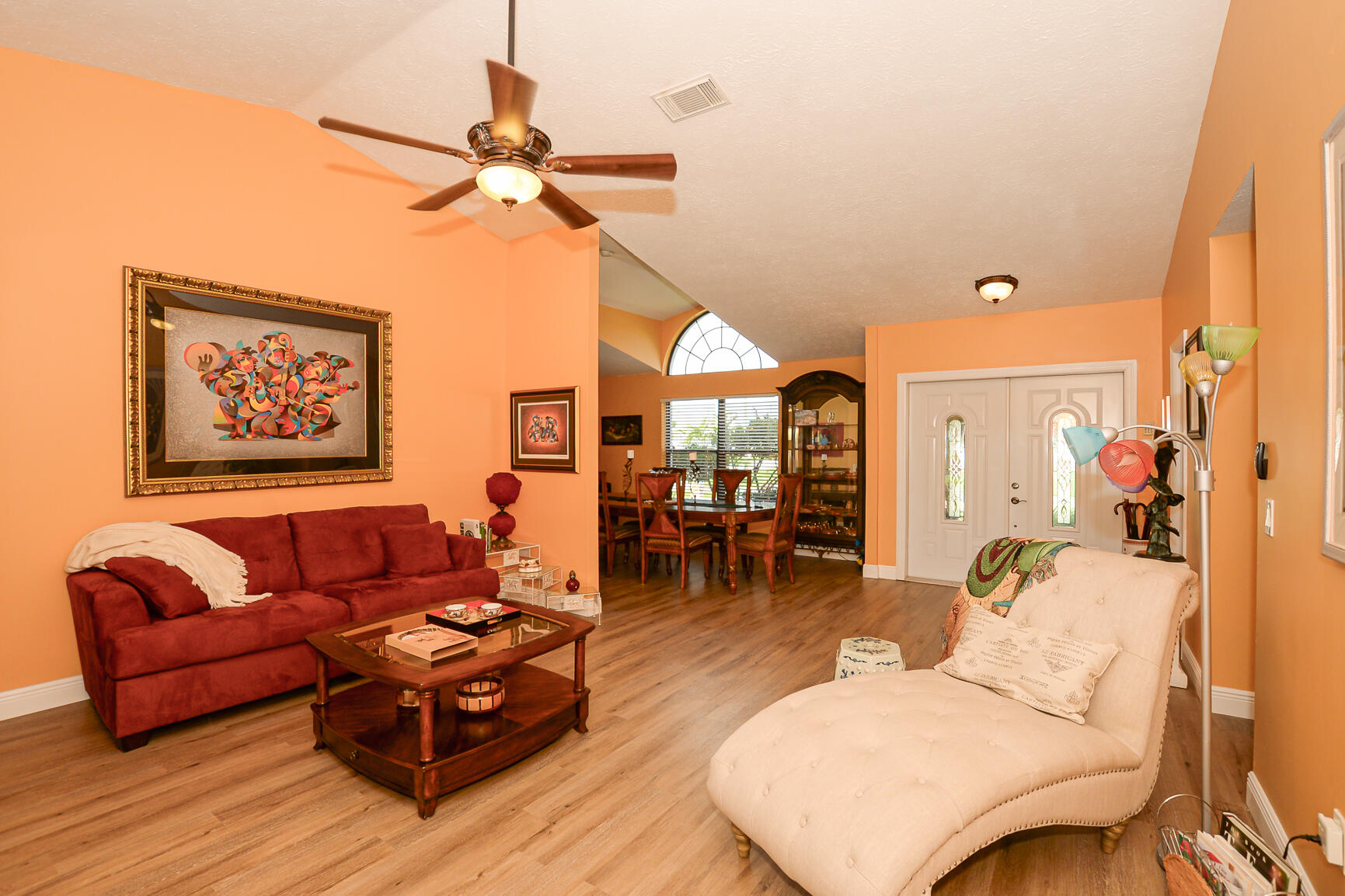 3068 Southeast Darien Road Port St. Lucie, FL 34952 - Photo 7 of 54 a living room with furniture and wooden floor