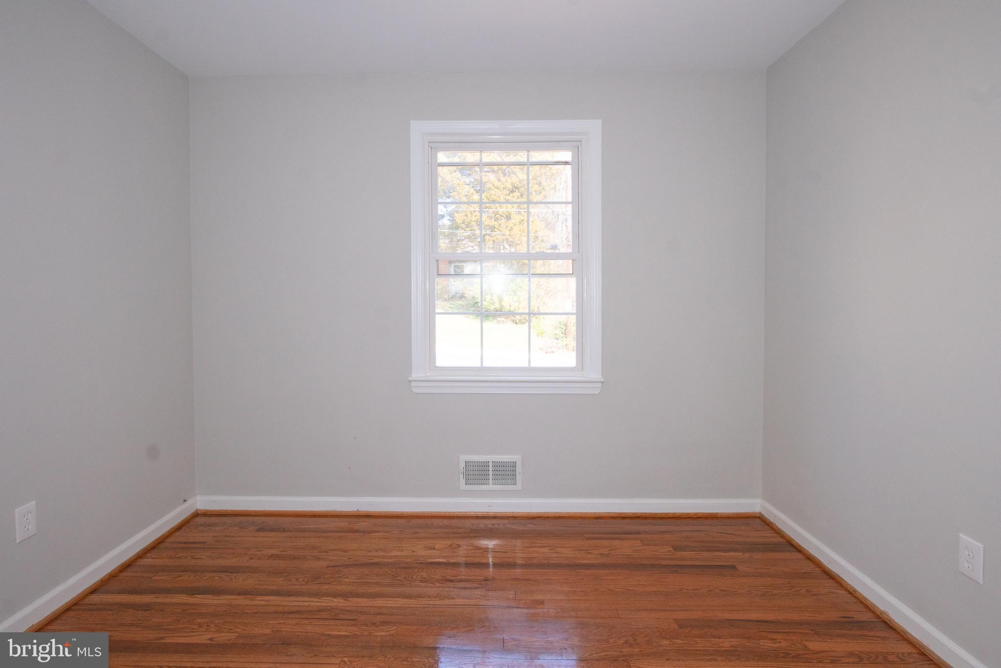 3404 Murdock Road Kensington, MD 20895 - Photo 16 of 24 a view of a room with wooden floor and window