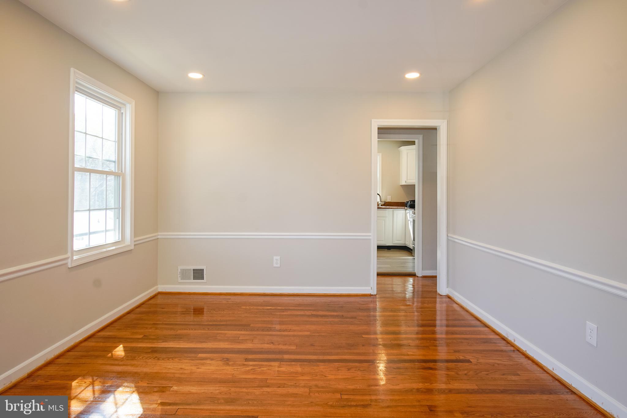 3404 Murdock Road Kensington, MD 20895 - Photo 6 of 24 a view of empty room with wooden floor and fan