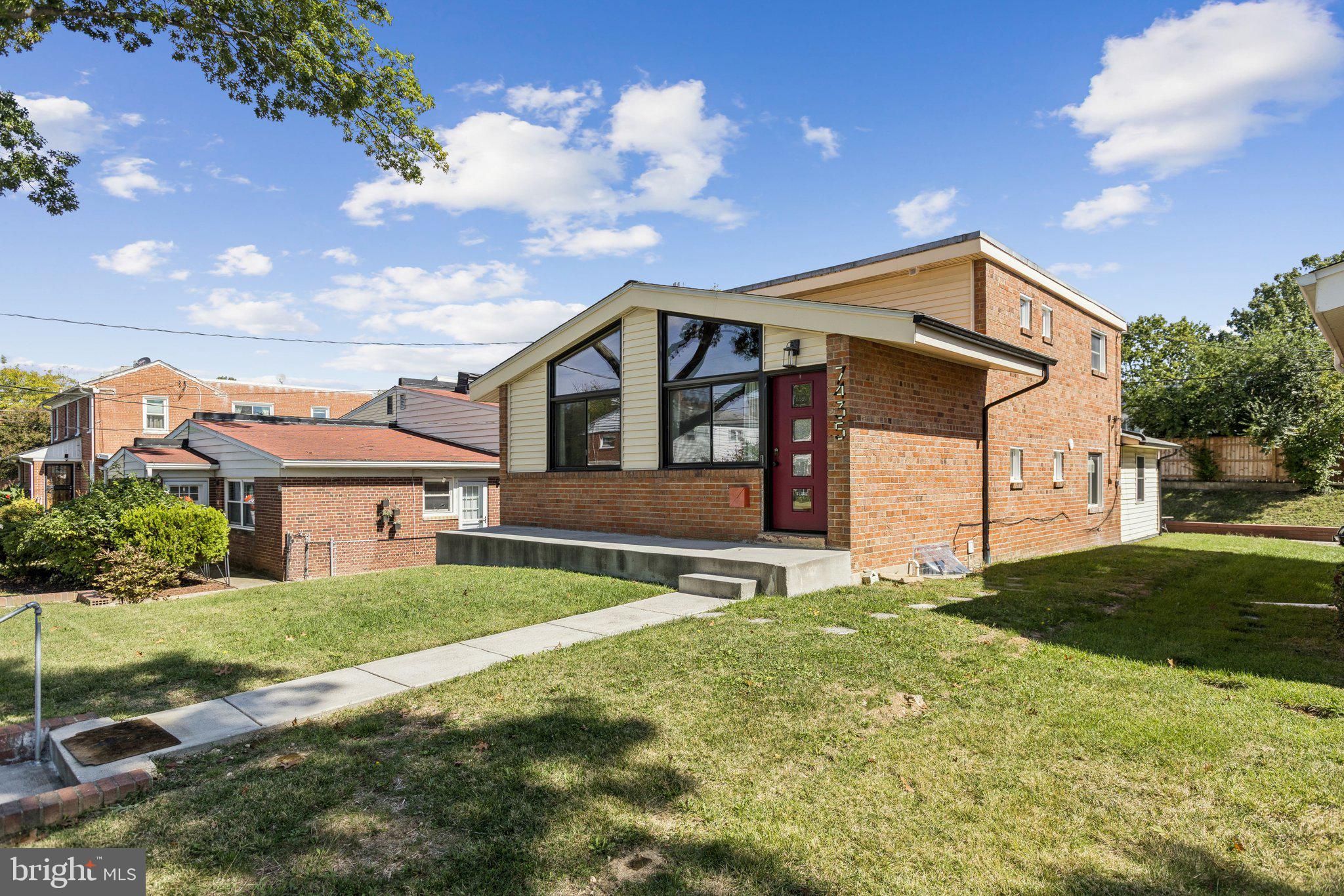 a front view of a house with a yard