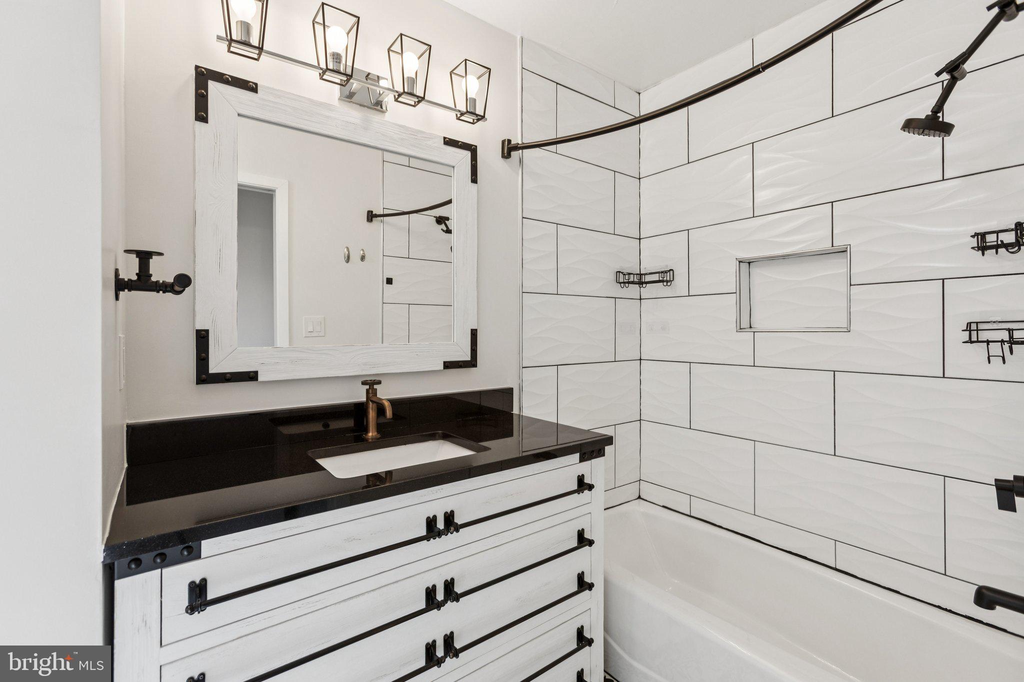 7435 8th Street Northwest Washington, DC 20012 - Photo 18 of 28 a bathroom with a bathtub and shower