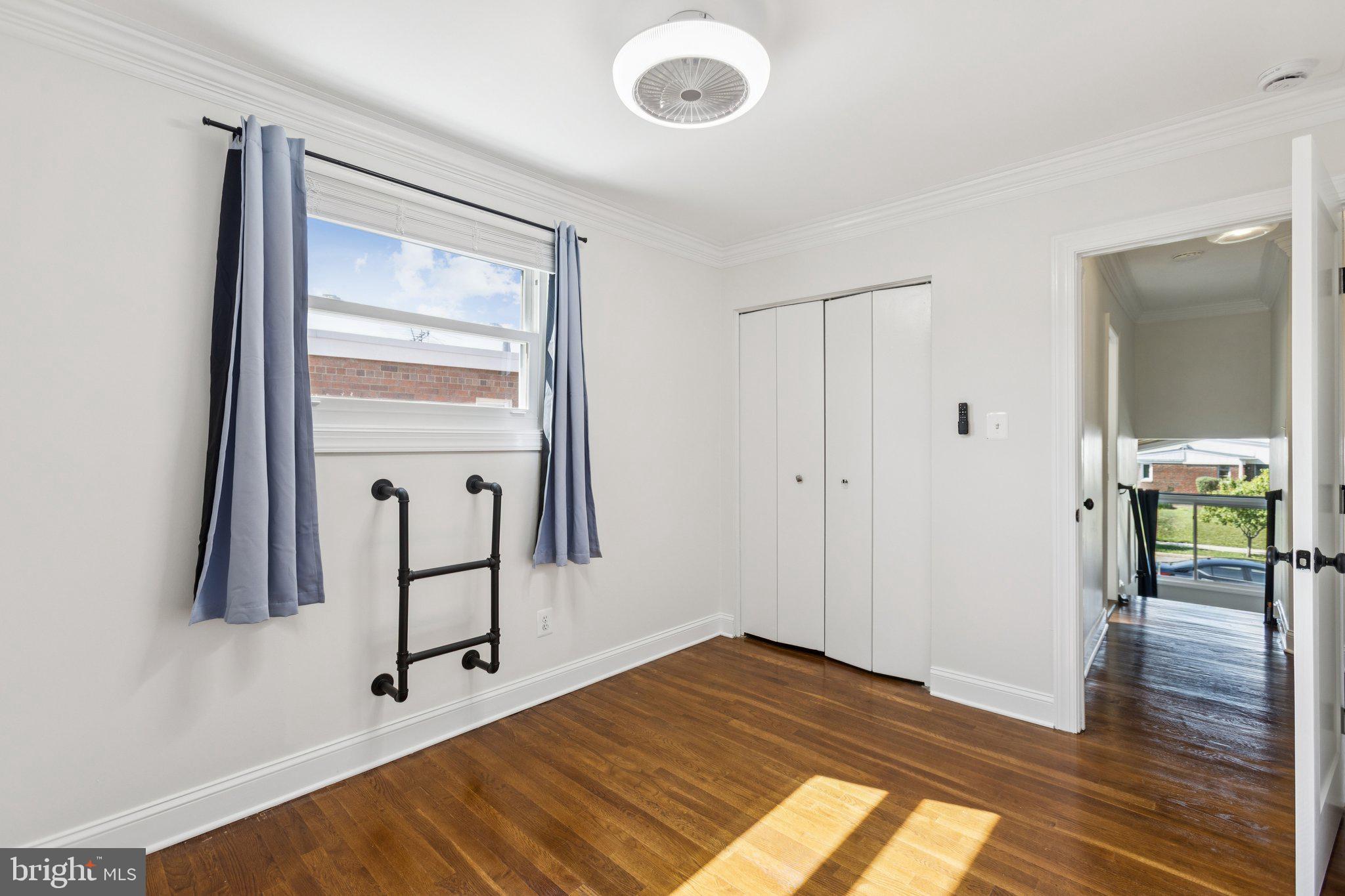 7435 8th Street Northwest Washington, DC 20012 - Photo 21 of 28 a view of a room that has a bed and a window in it