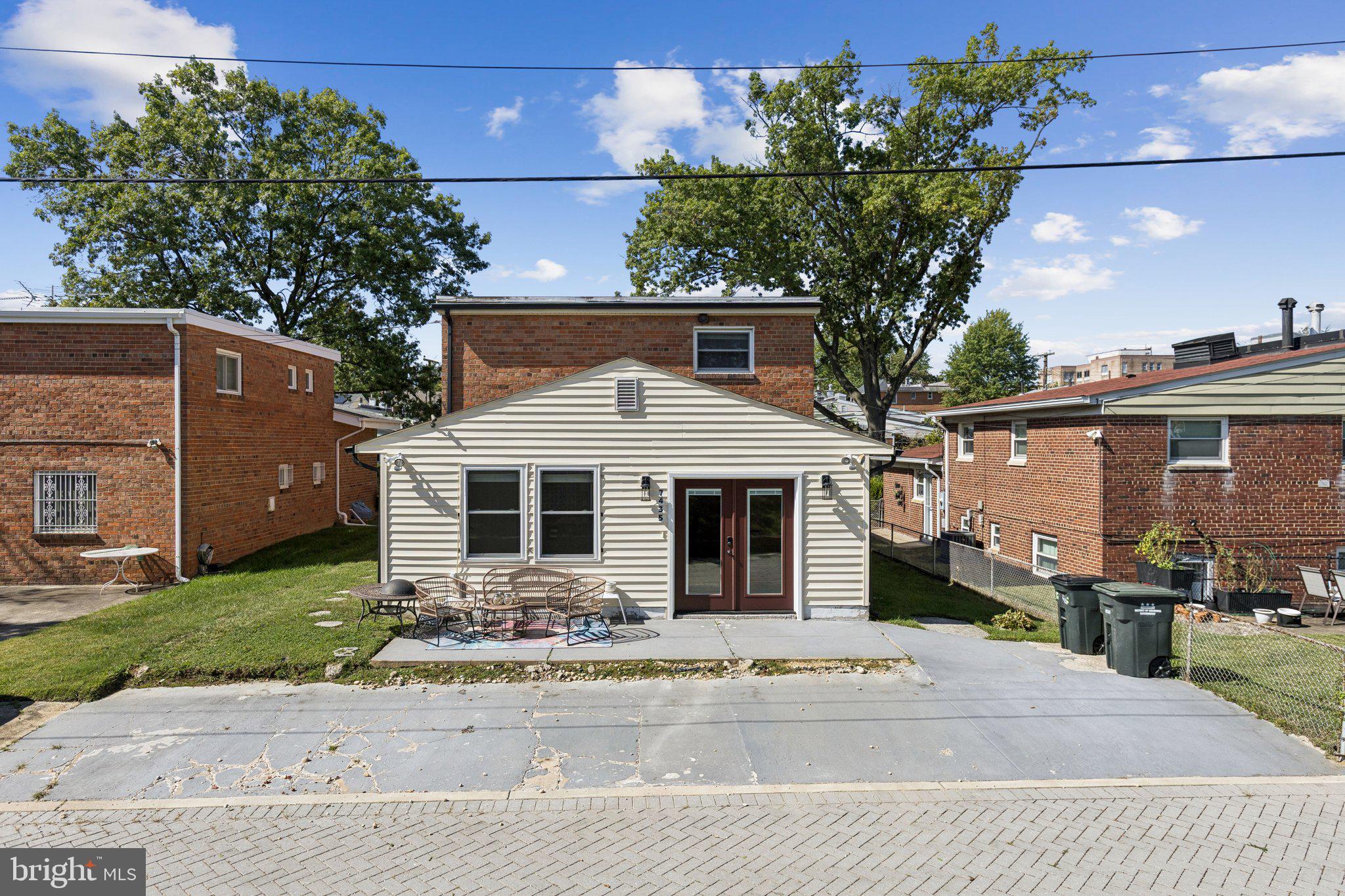7435 8th Street Northwest Washington, DC 20012 - Photo 23 of 28 a front view of a house with garden