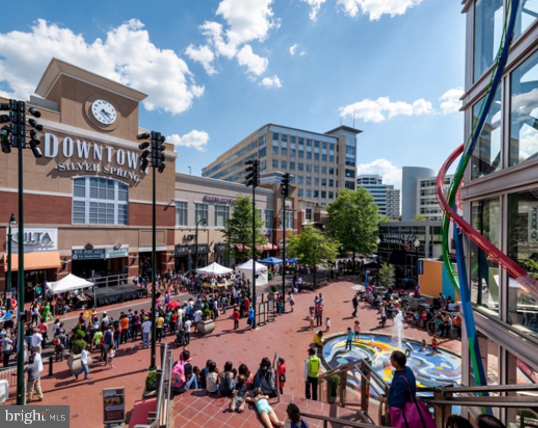 7435 8th Street Northwest Washington, DC 20012 - Photo 25 of 28 a city street filled with lots of traffic and tall building