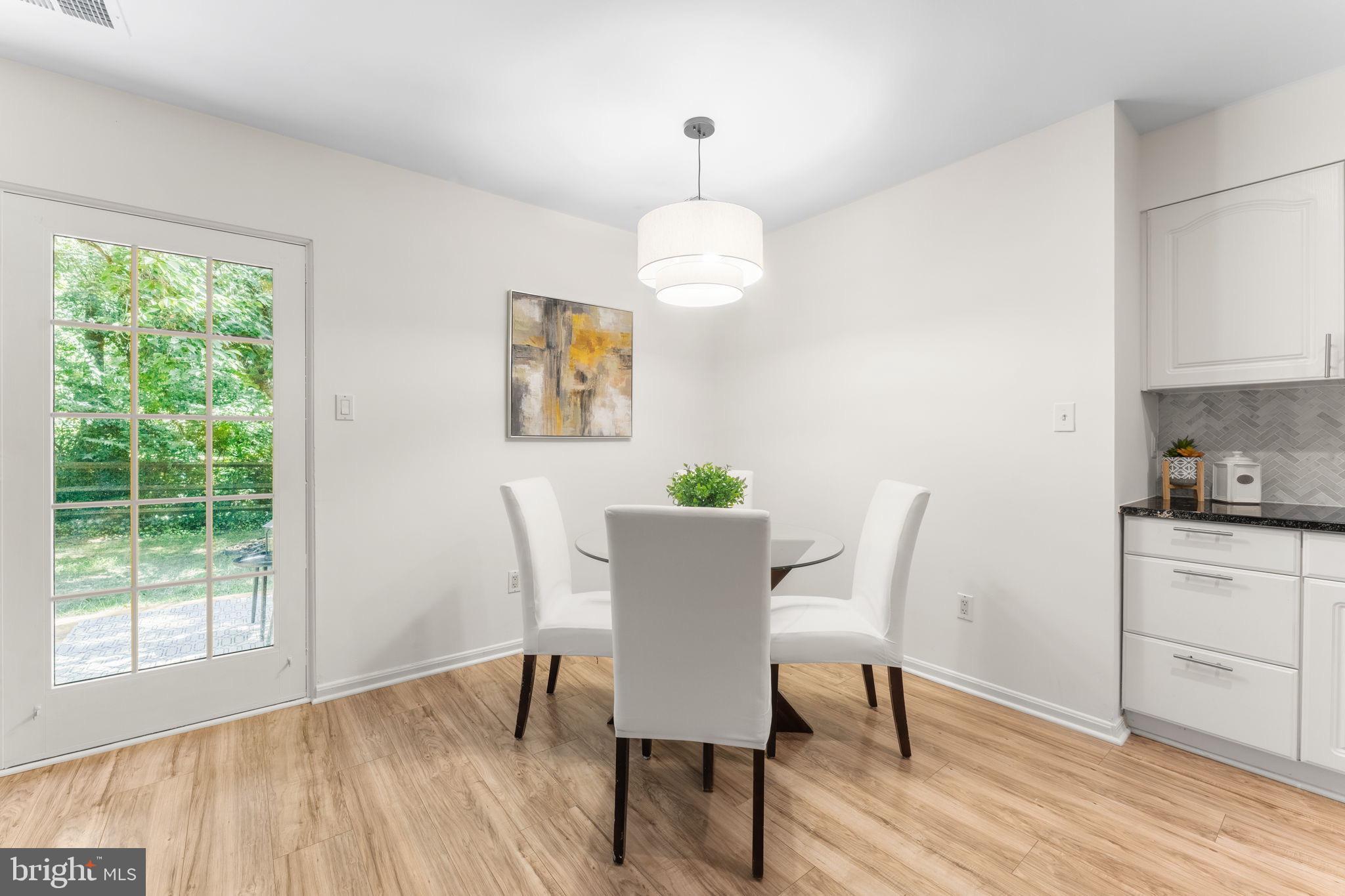 11401 Turnmill Lane Reston, VA 20191 - Photo 17 of 81 a view of a dining room with furniture window and wooden floor