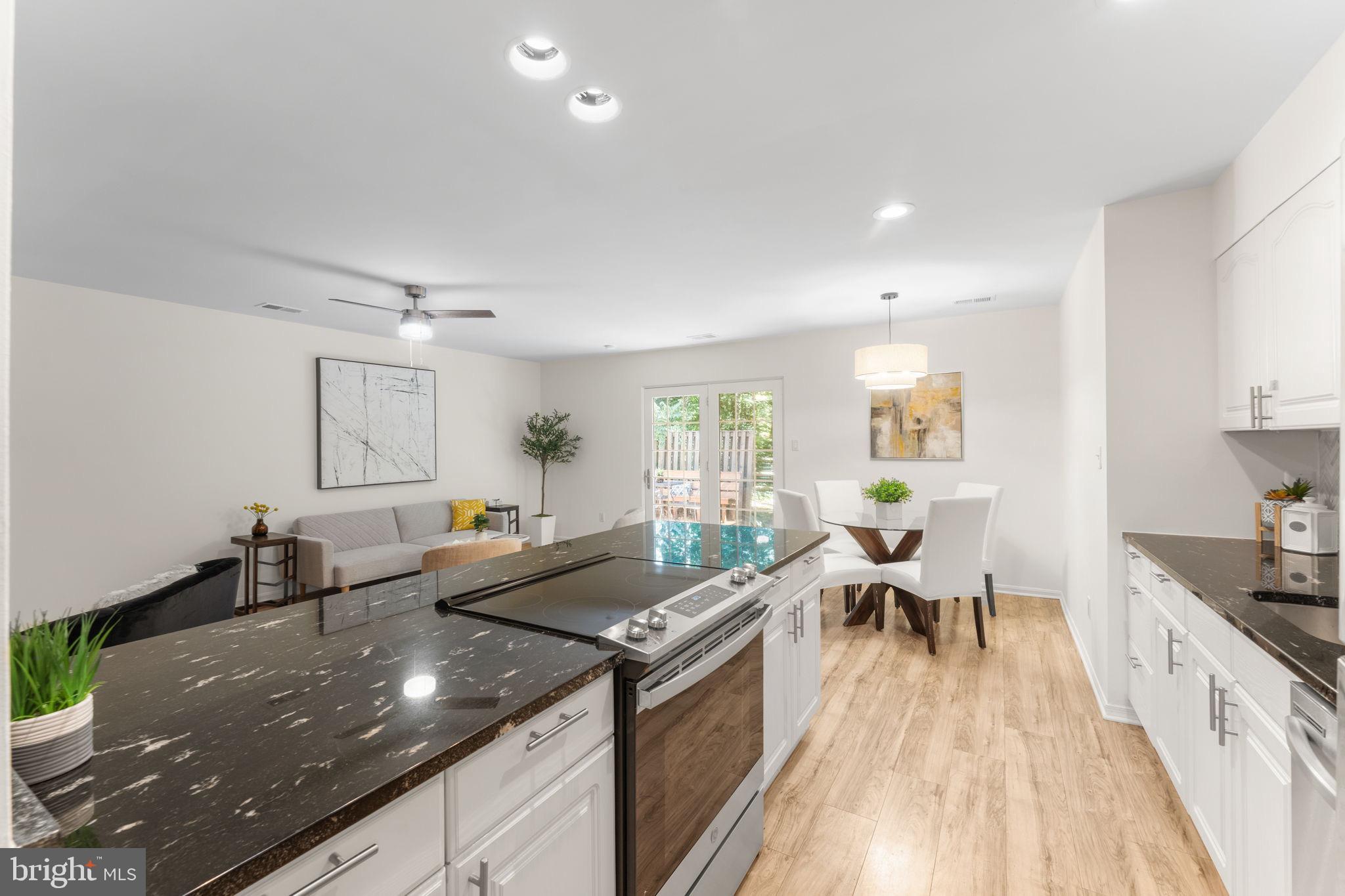 11401 Turnmill Lane Reston, VA 20191 - Photo 22 of 81 a kitchen with granite countertop lots of counter top space and dining table
