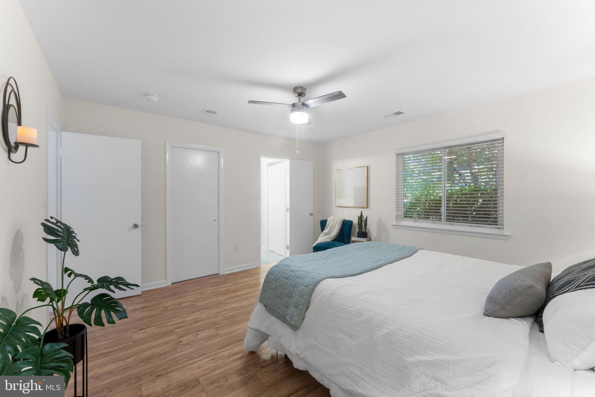 11401 Turnmill Lane Reston, VA 20191 - Photo 29 of 81 a bedroom with a bed dresser and a window