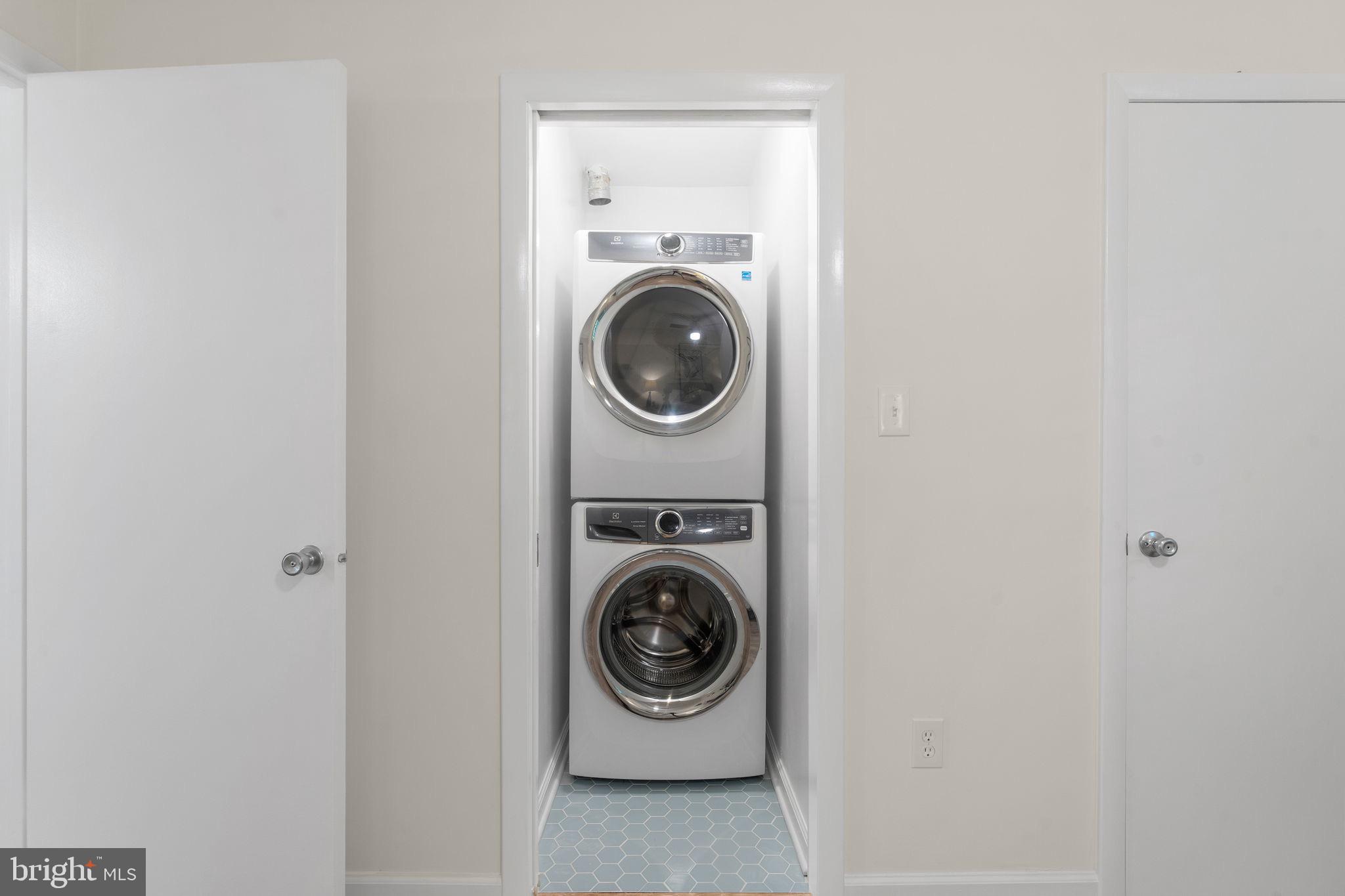 11401 Turnmill Lane Reston, VA 20191 - Photo 33 of 81 Efficient laundry space in a modern home.
