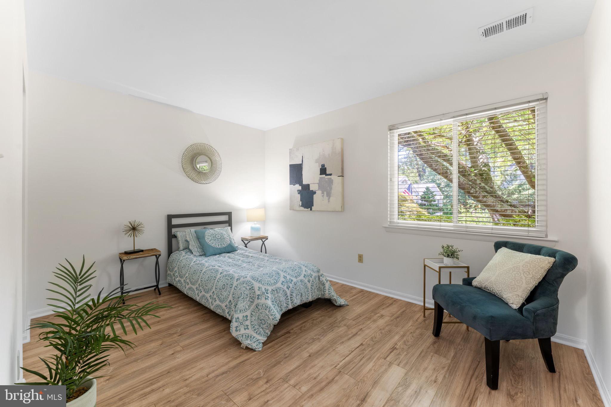 11401 Turnmill Lane Reston, VA 20191 - Photo 36 of 81 Serene bedroom with natural light and style.