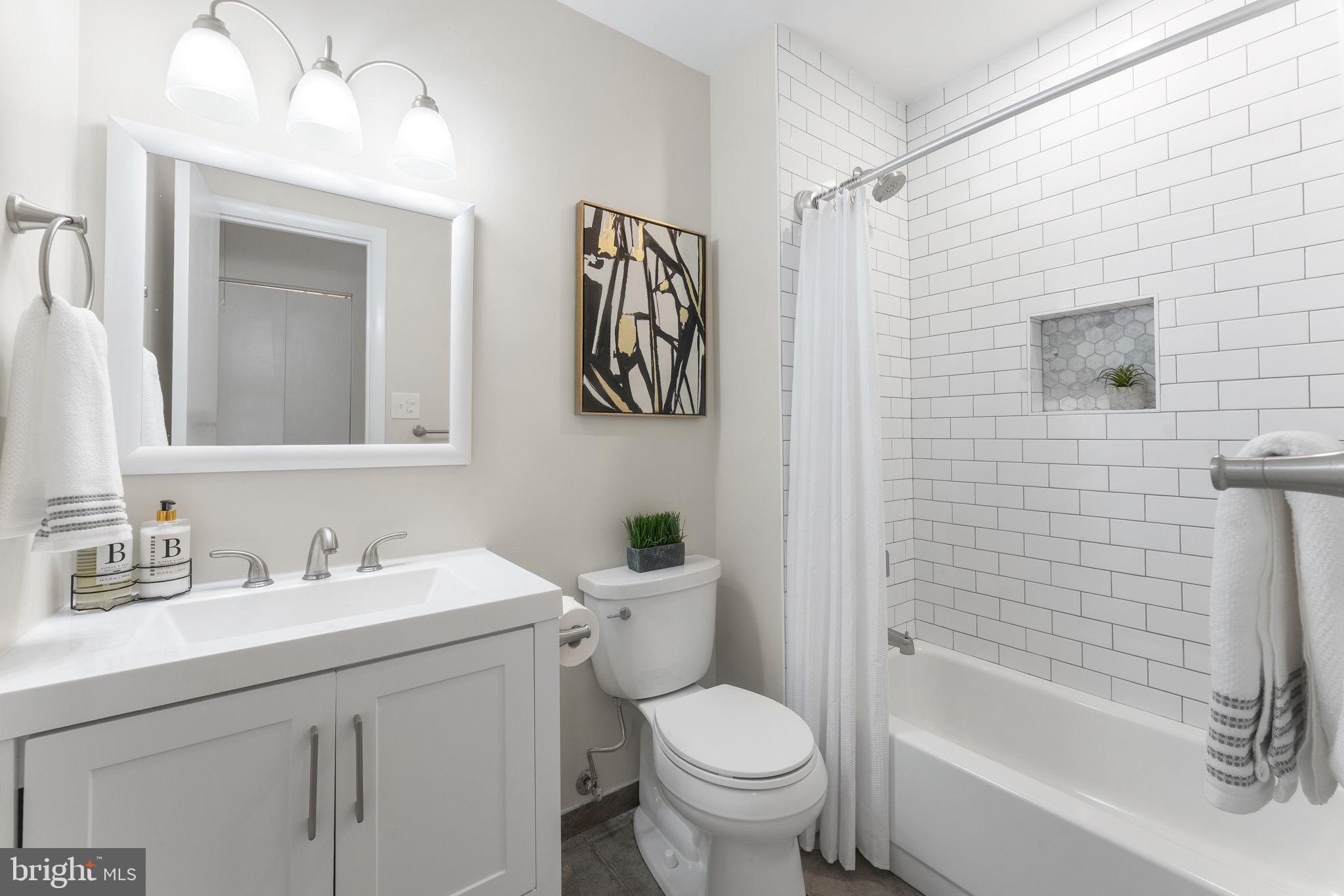 11401 Turnmill Lane Reston, VA 20191 - Photo 38 of 81 a bathroom with a sink toilet and shower