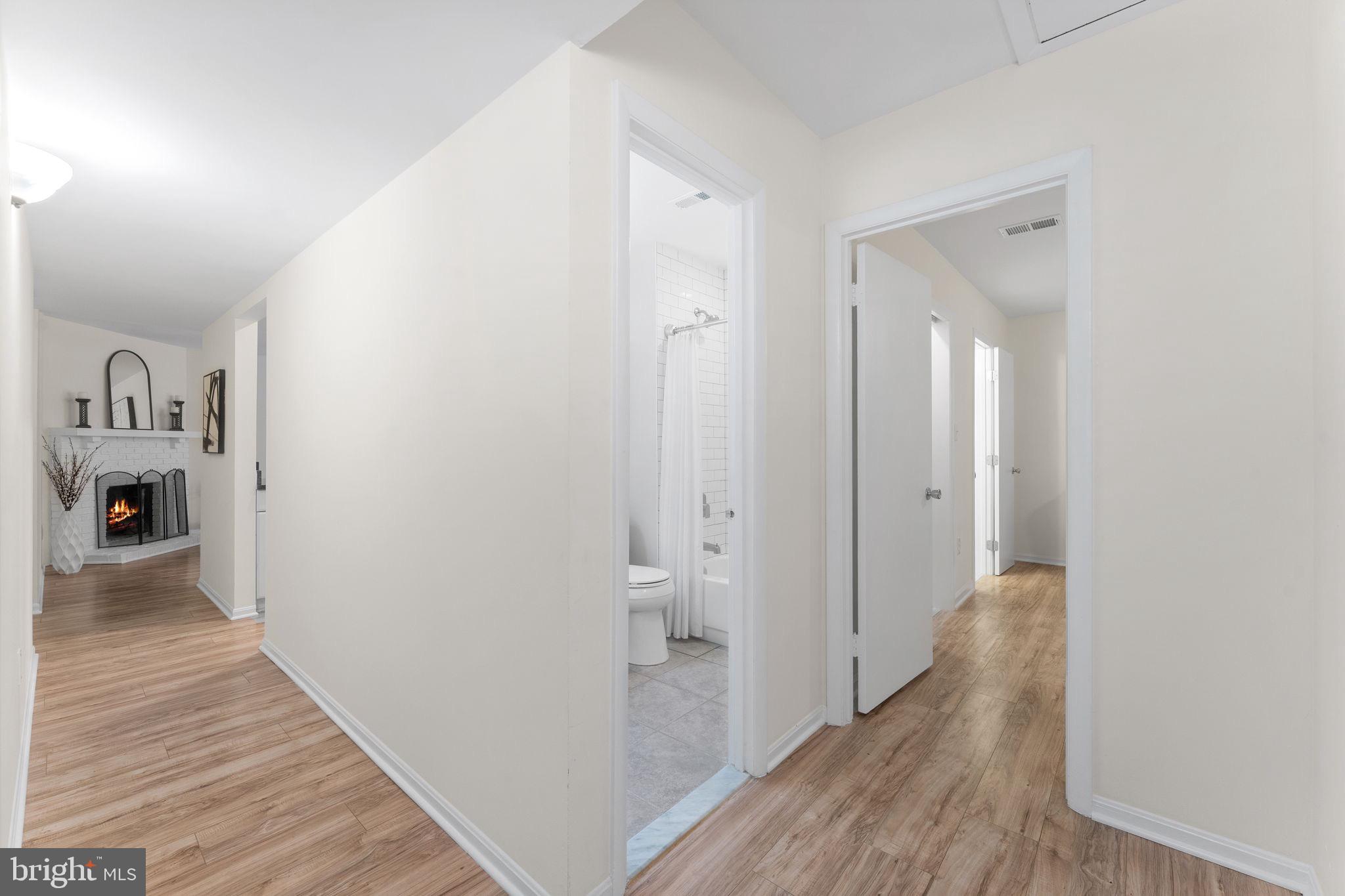 11401 Turnmill Lane Reston, VA 20191 - Photo 40 of 81 Inviting hallway with warm wood floors.