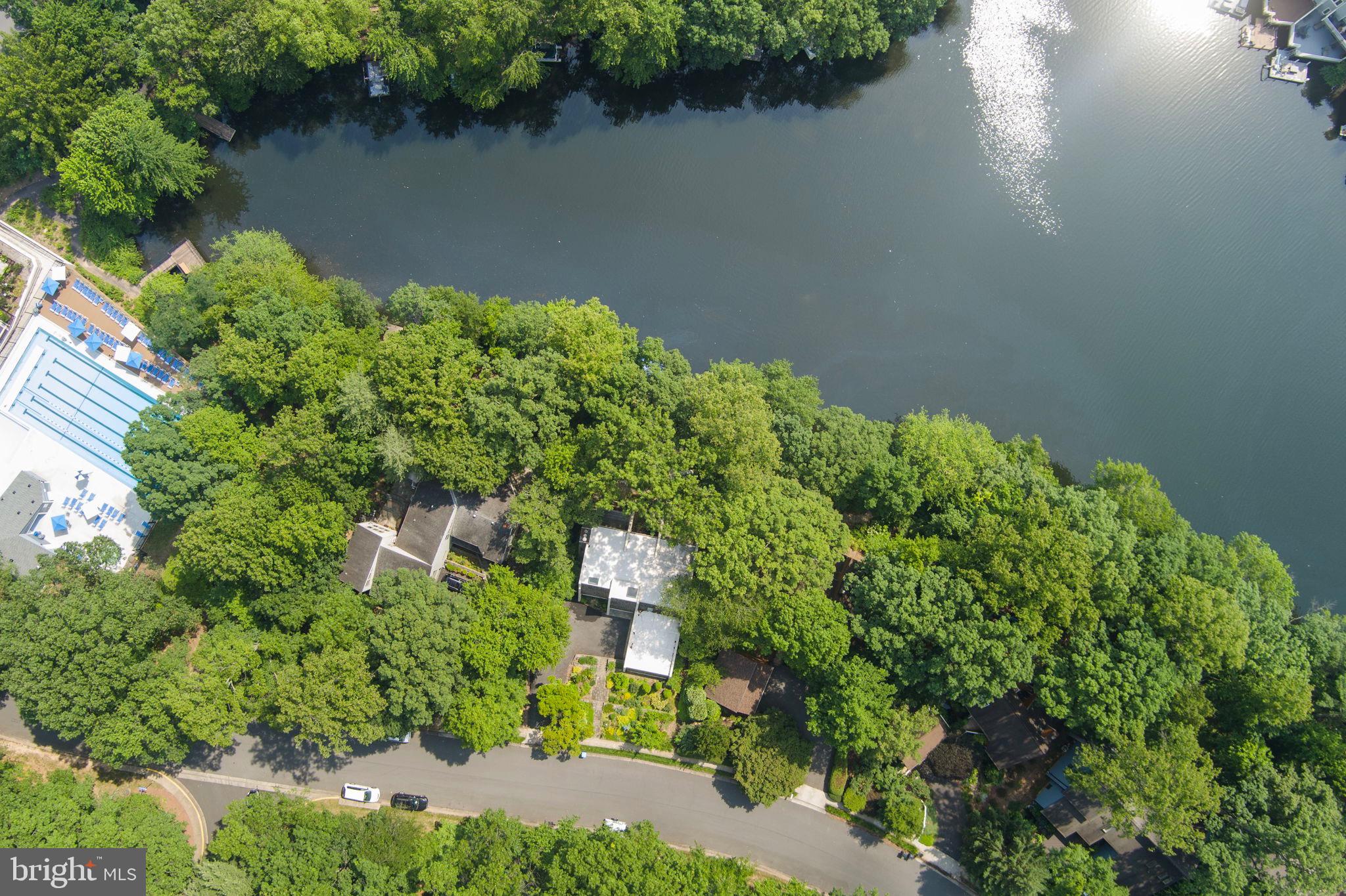 11401 Turnmill Lane Reston, VA 20191 - Photo 56 of 81 Lush greenery embraces serene waterside homes.