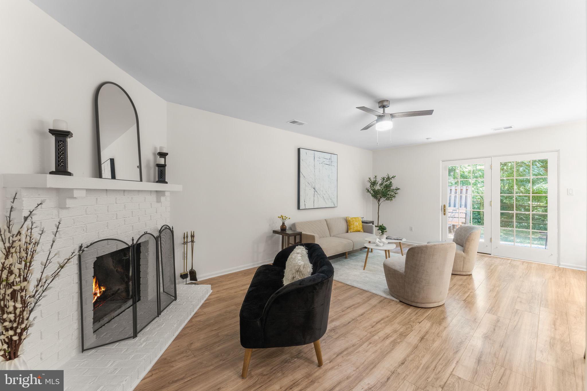 11401 Turnmill Lane Reston, VA 20191 - Photo 7 of 81 a living room with furniture and a fireplace