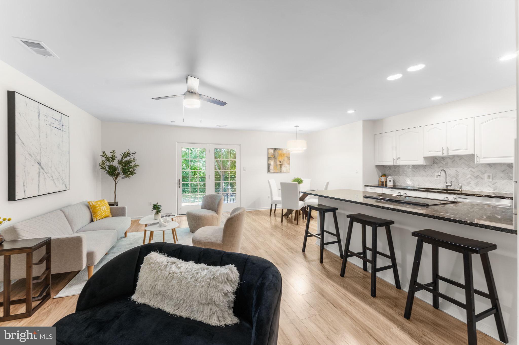 11401 Turnmill Lane Reston, VA 20191 - Photo 10 of 81 a living room with furniture and wooden floor