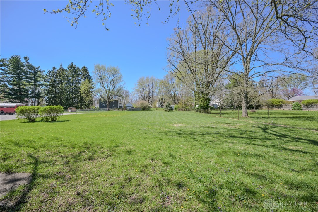 3057 Springfield Xenia Road Springfield, OH 45506 - Photo 34 of 37 Expansive green grounds with mature trees offers a serene setting.