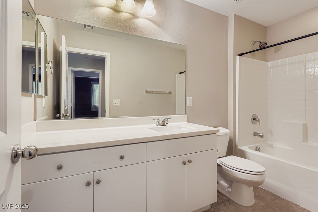 5712 Wishing Coin Court North Las Vegas, NV 89031 - Photo 19 of 24 Upstairs Full bathroom with vanity, shower combination, and tile patterned floors