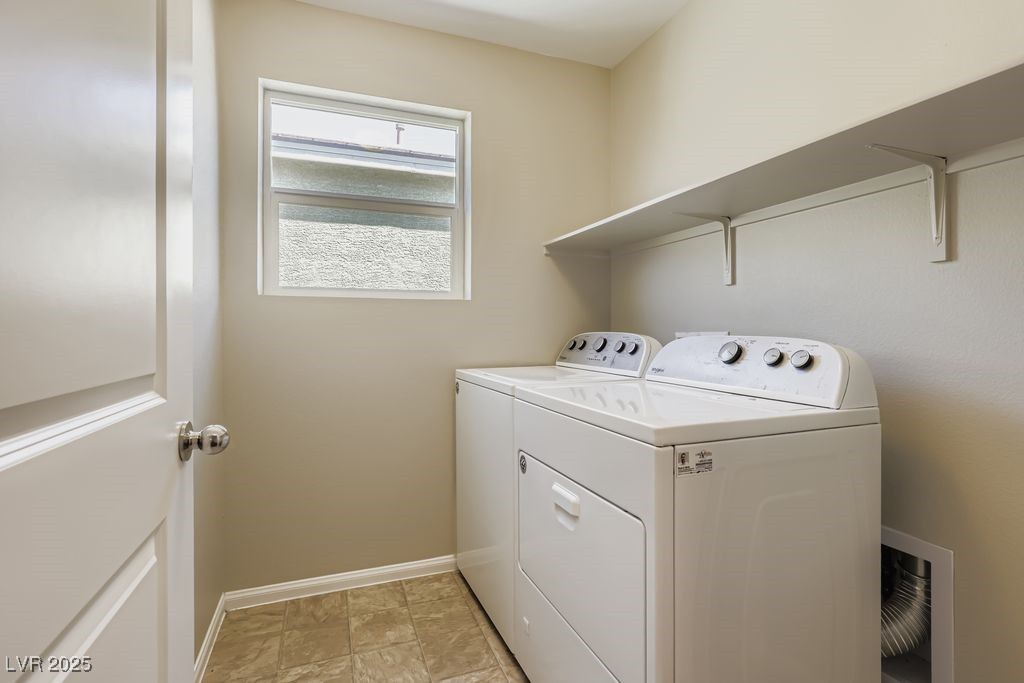 5712 Wishing Coin Court North Las Vegas, NV 89031 - Photo 22 of 24 Upstairs Laundry room featuring baseboards and washing machine and clothes dryer
