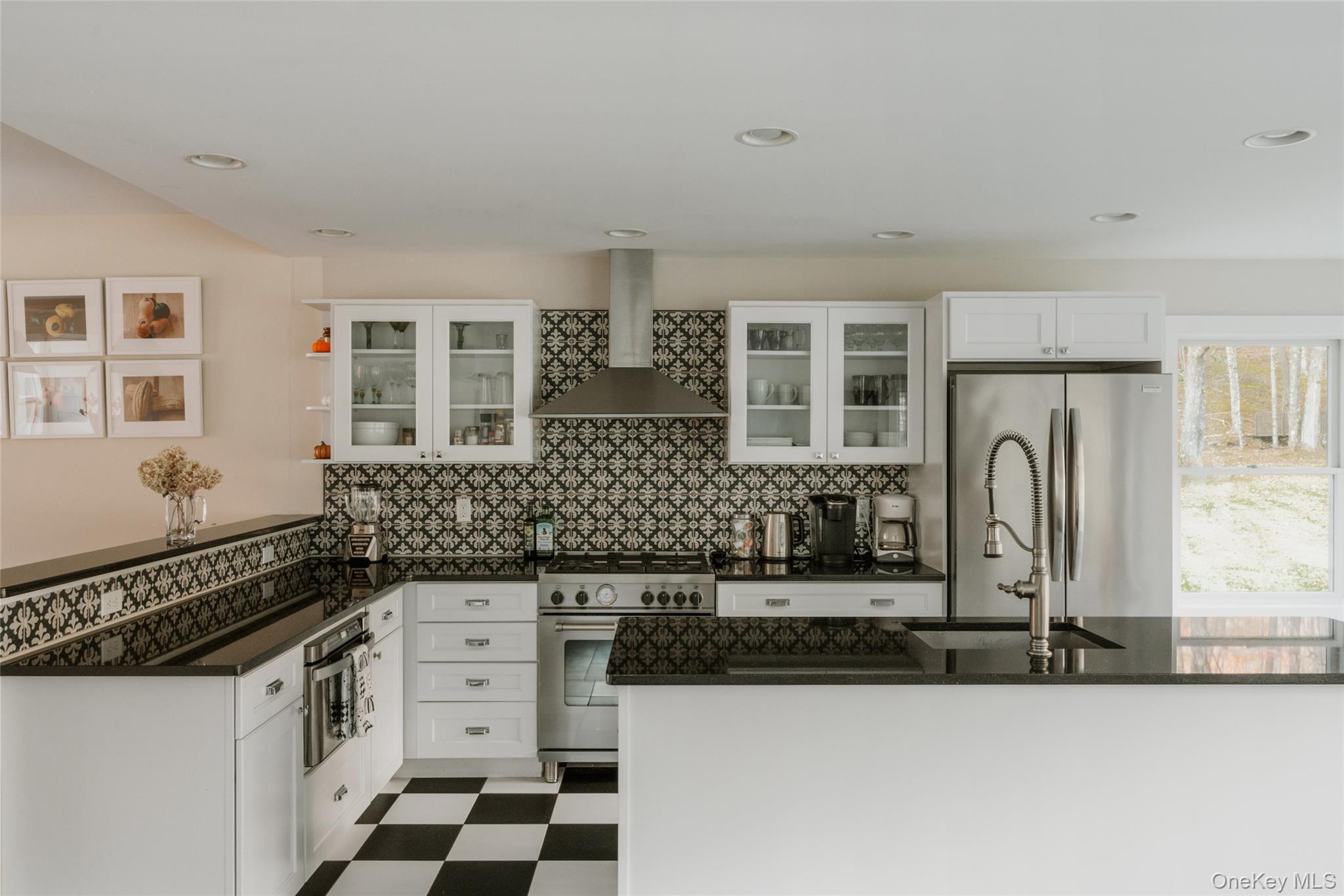 7775 State Rte 55 Neversink, NY 12765 - Photo 12 of 46 a kitchen with granite countertop a stove and a sink