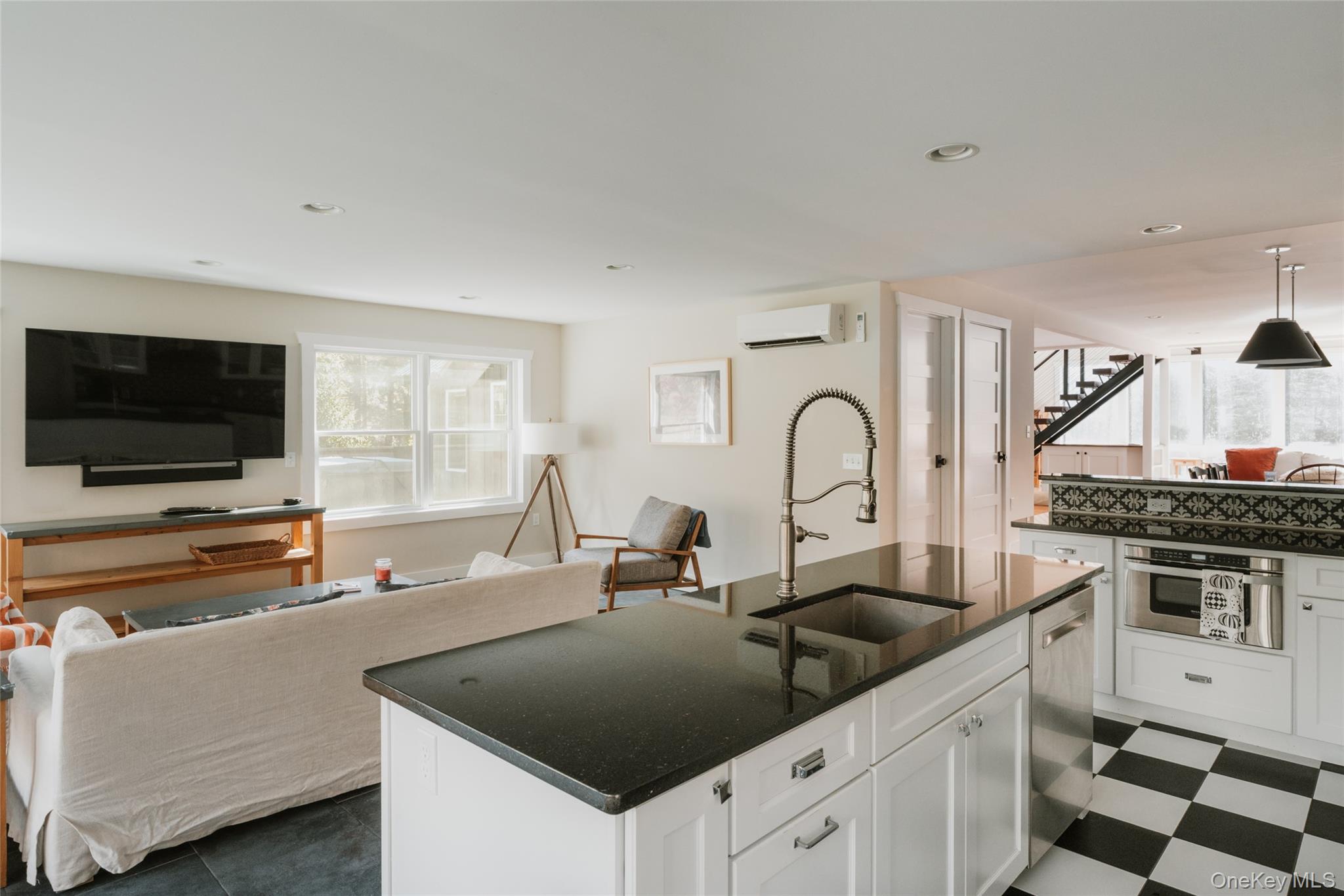 7775 State Rte 55 Neversink, NY 12765 - Photo 46 of 46 a kitchen with stainless steel appliances granite countertop a stove a sink and a microwave