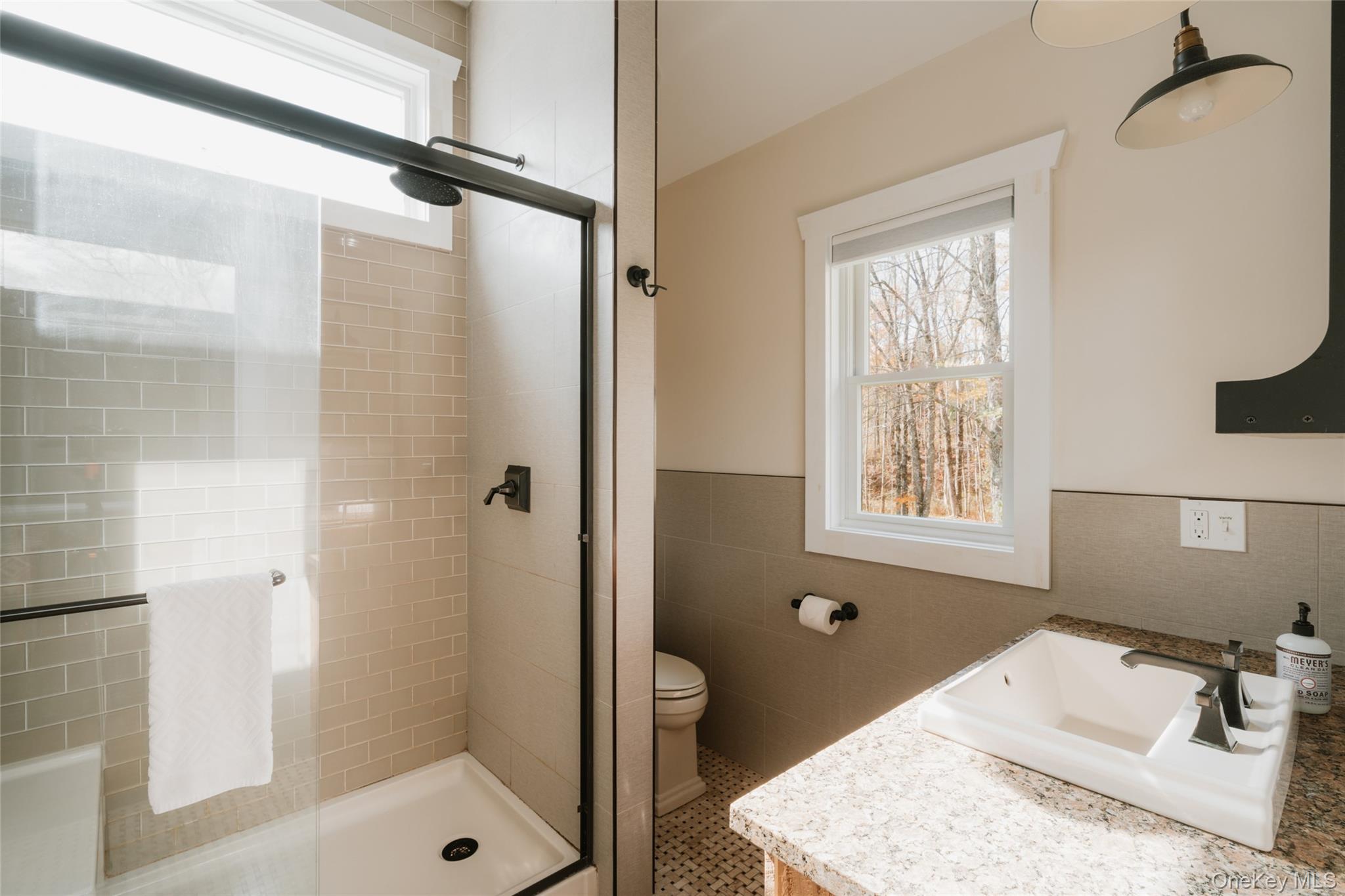 7775 State Rte 55 Neversink, NY 12765 - Photo 25 of 46 a bathroom with a tub shower vanity and a sink