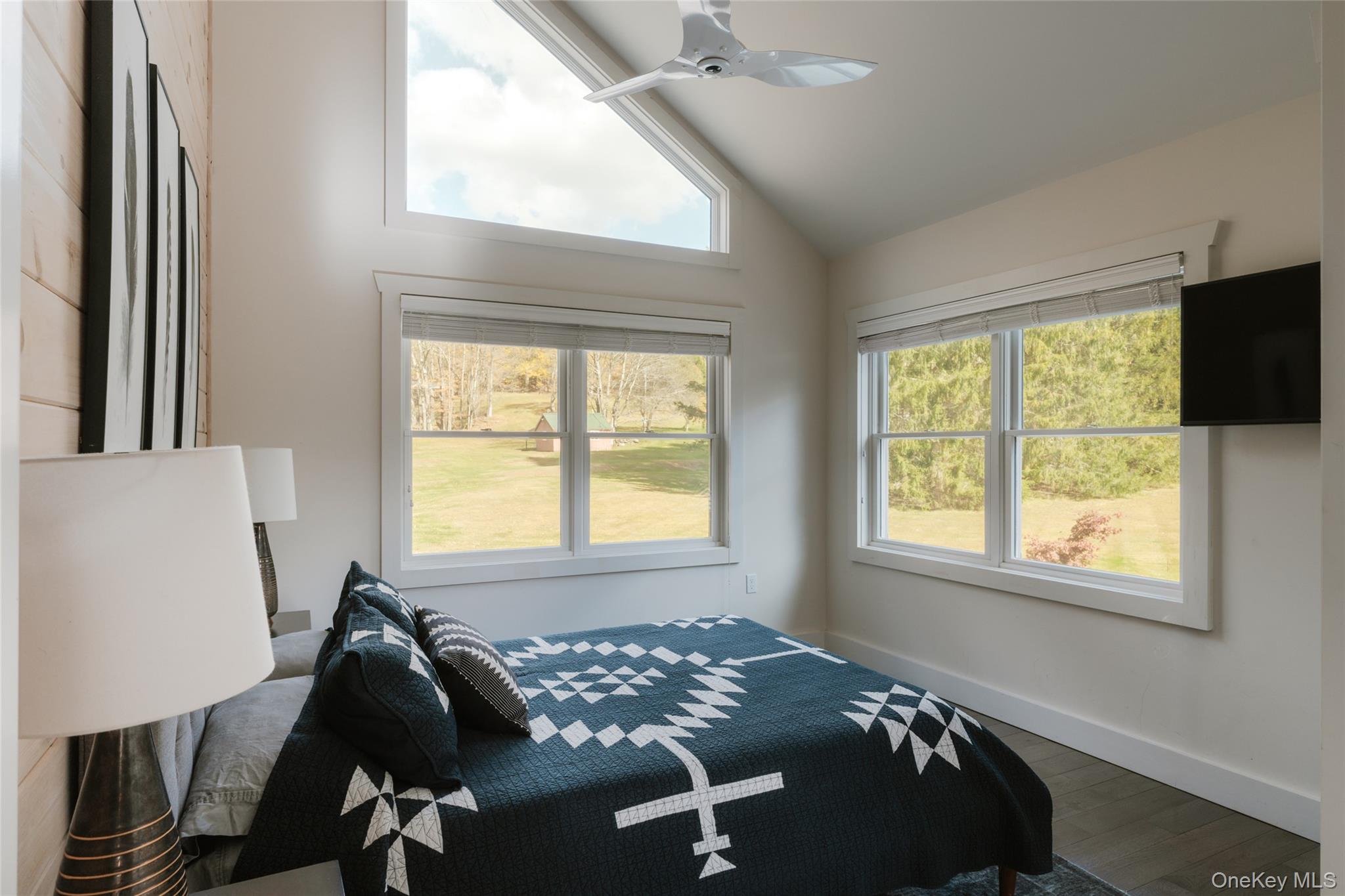 7775 State Rte 55 Neversink, NY 12765 - Photo 26 of 46 a bed sitting in a bedroom next to a window