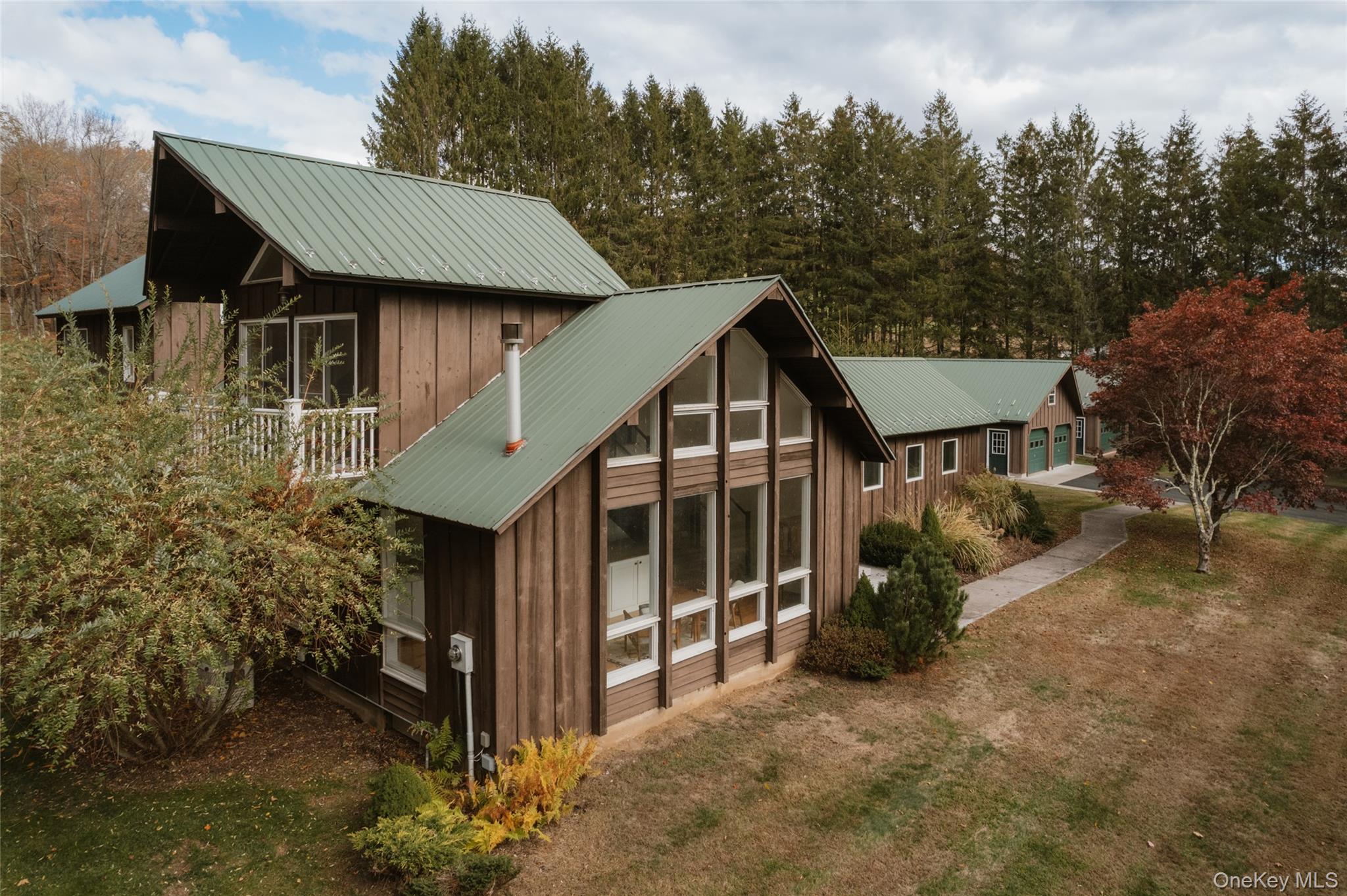 7775 State Rte 55 Neversink, NY 12765 - Photo 3 of 46 a view of a house with a yard and sitting area