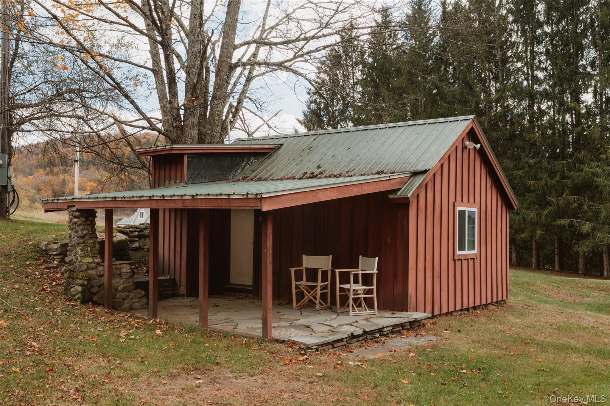 7775 State Rte 55 Neversink, NY 12765 - Photo 32 of 46 a view of a house with a yard and wooden fence