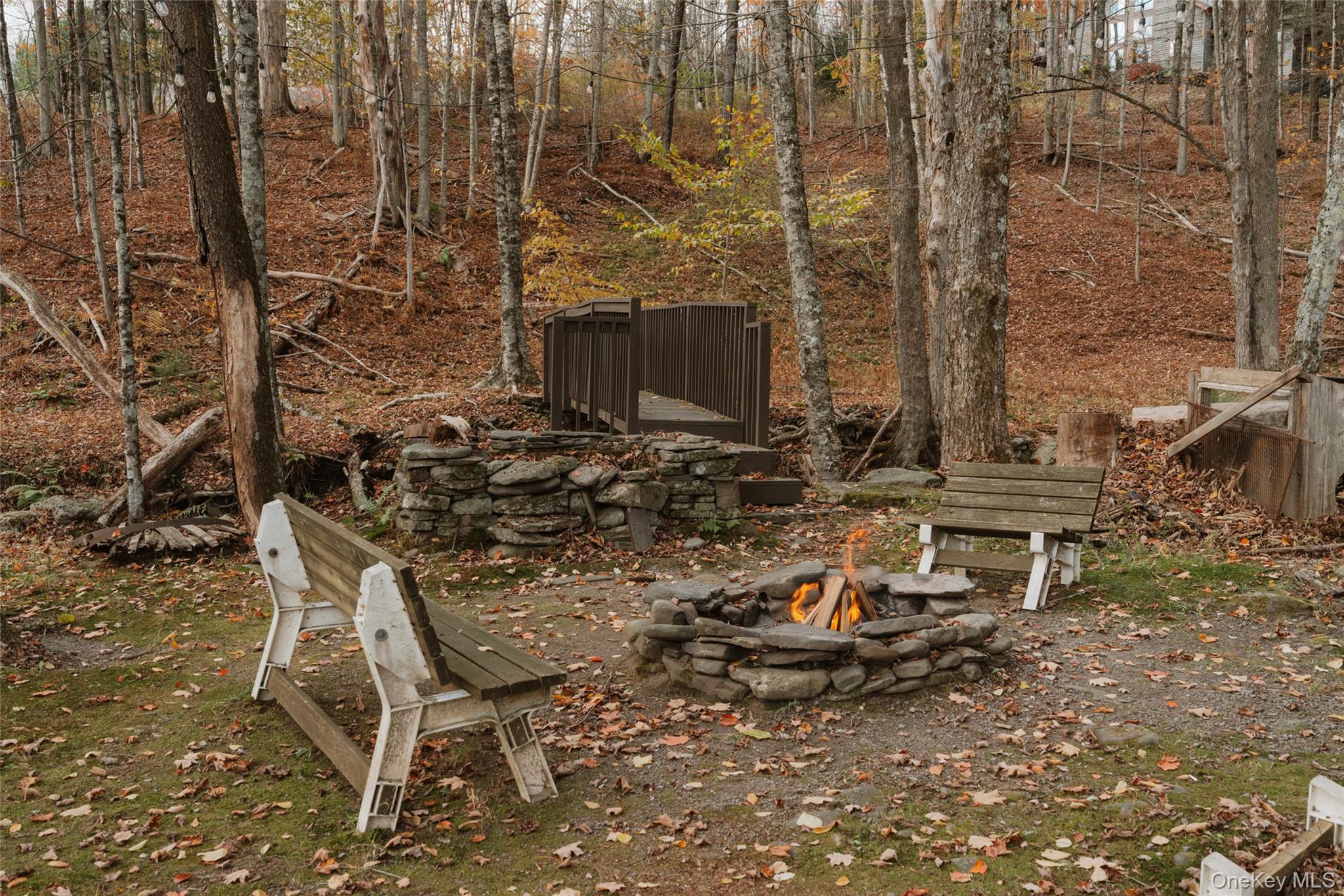 7775 State Rte 55 Neversink, NY 12765 - Photo 36 of 46 a view of a backyard with table and chairs