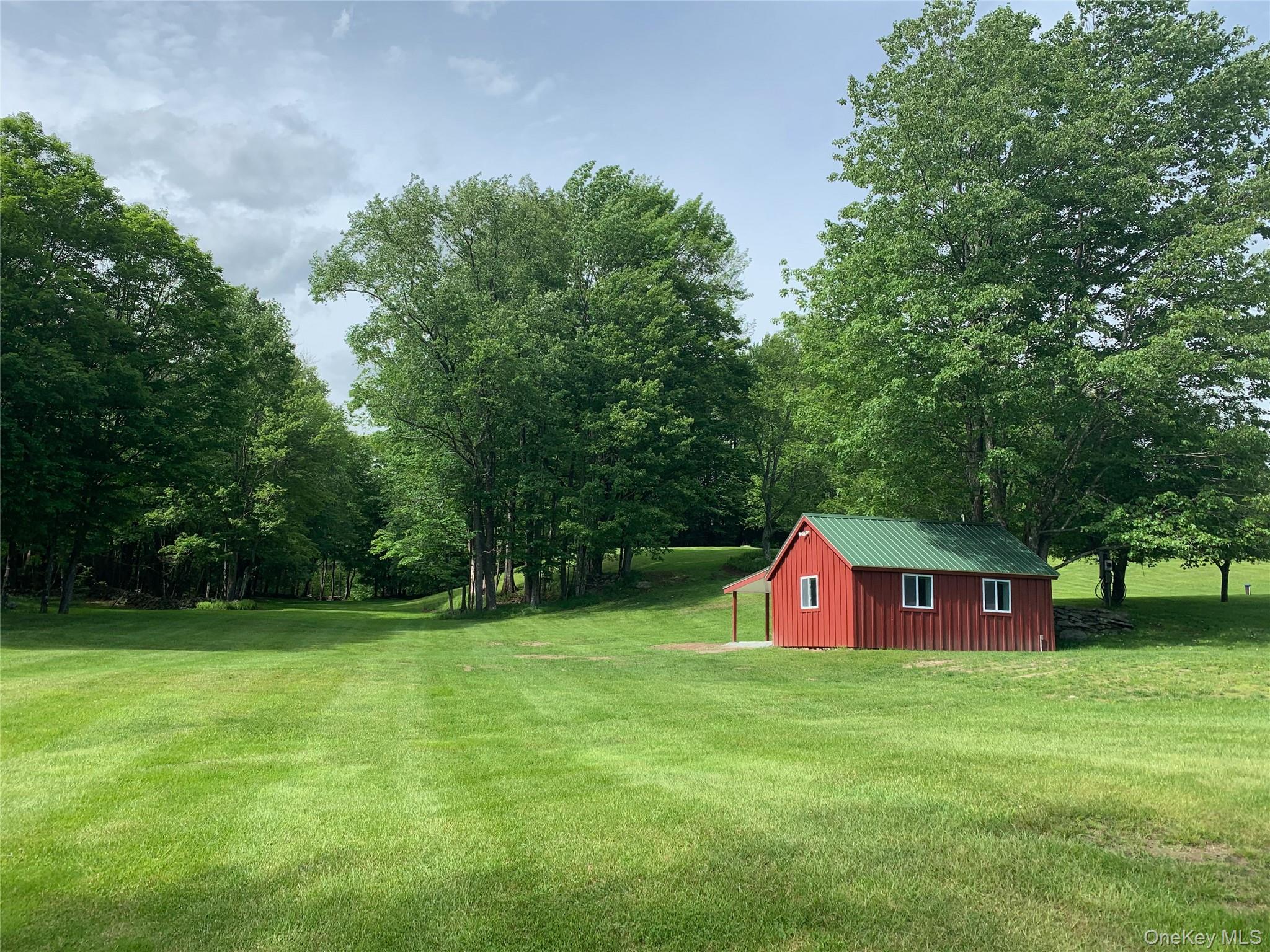 7775 State Rte 55 Neversink, NY 12765 - Photo 44 of 46 a view of outdoor space with sign board and green space