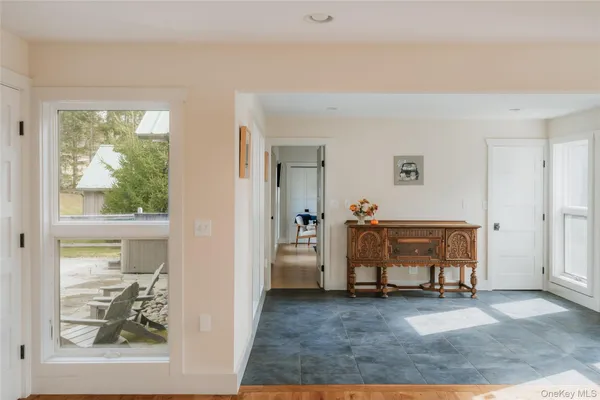 a view of a livingroom with furniture and a window