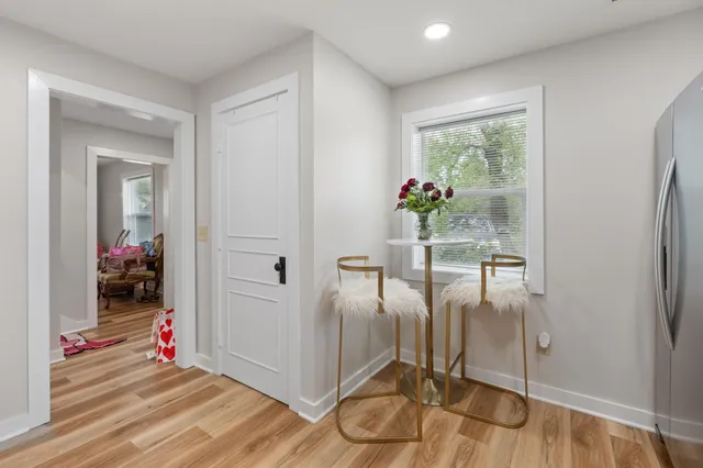 a bedroom with furniture and a window