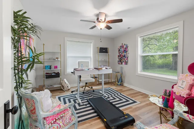 a living room with furniture and a window
