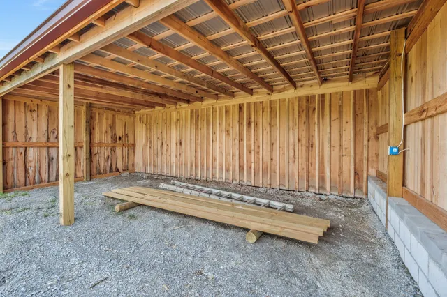 a view of a room with wooden walls