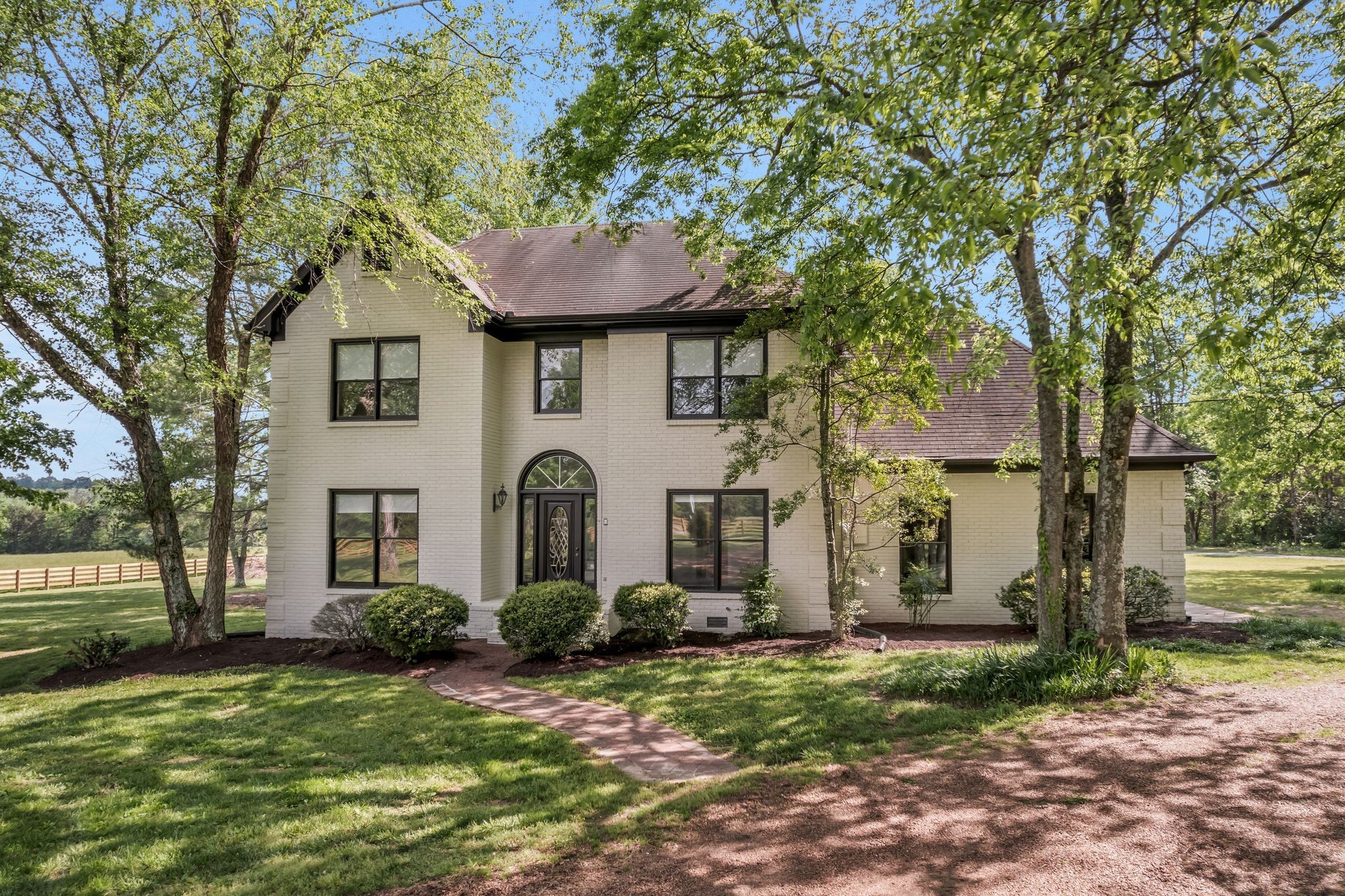 4519 Murfreesboro Road Franklin, TN 37067 - Photo 4 of 51 a front view of a house with garden
